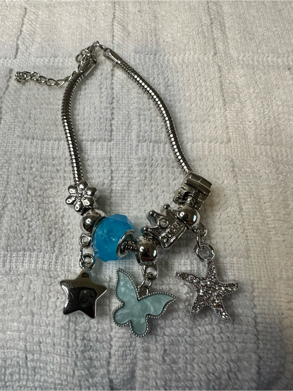 Unk Silver-Tone Bracelet with Blue Bead and Sea & Nature Charms